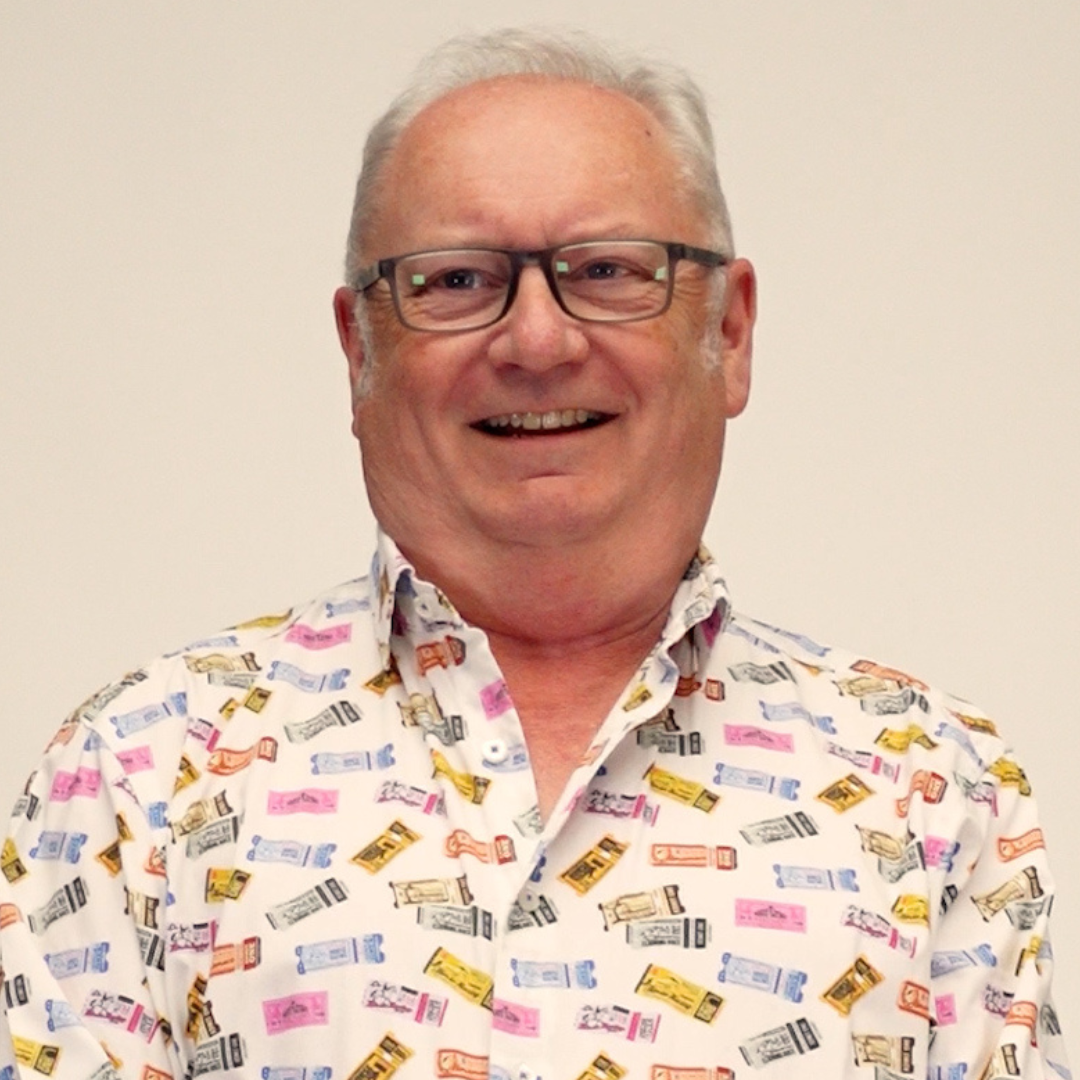 John in a shirt covered in ticket images